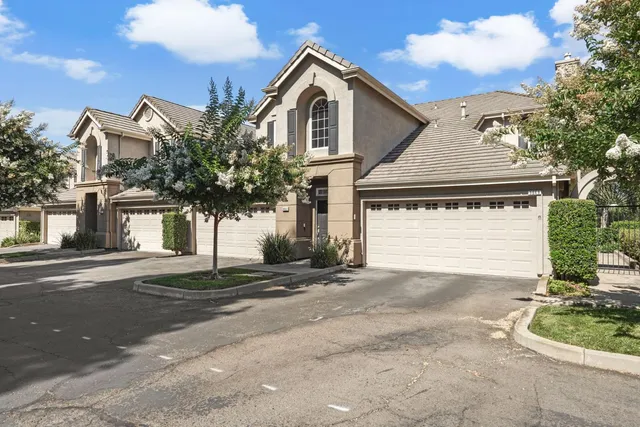 a view of street along with house and trees