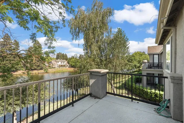 a small house with a tree in front of it