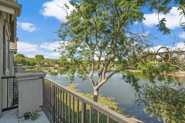 a balcony with view of tree