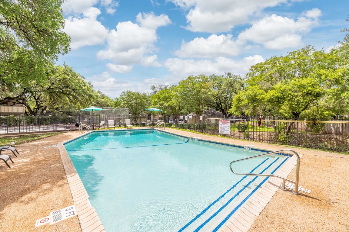 8405 Bent Tree Road, Unit 3414 Austin, TX 78759 - Photo 14 of 20 Community pool with a patio area and view of wooded area