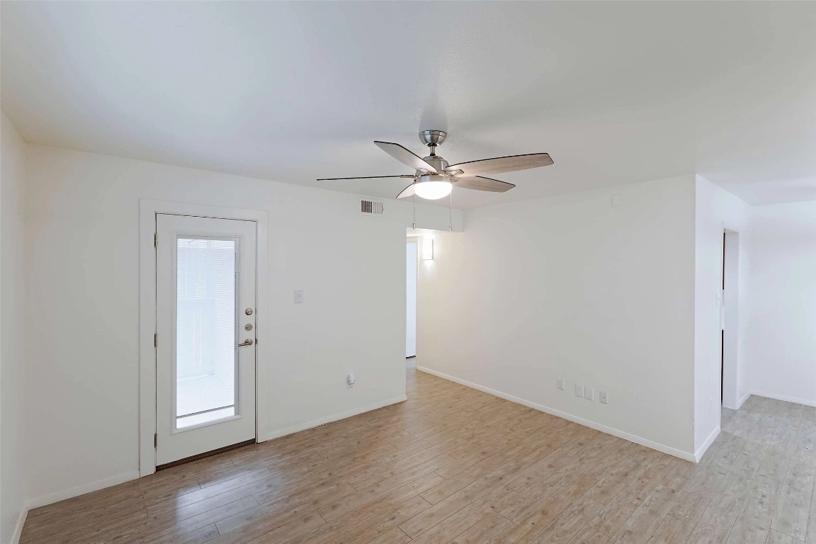 8405 Bent Tree Road, Unit 3414 Austin, TX 78759 - Photo 7 of 20 Unfurnished room featuring light wood finished floors and a ceiling fan