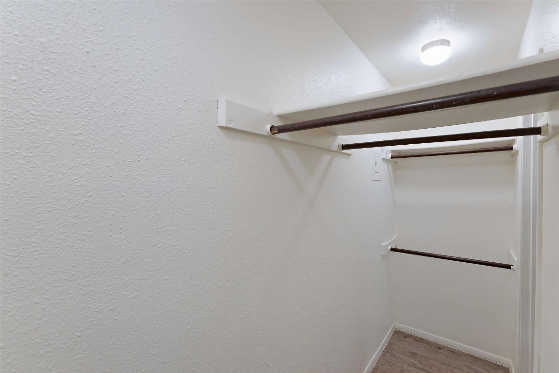 8405 Bent Tree Road, Unit 3414 Austin, TX 78759 - Photo 10 of 20 Walk in closet featuring light wood-type flooring