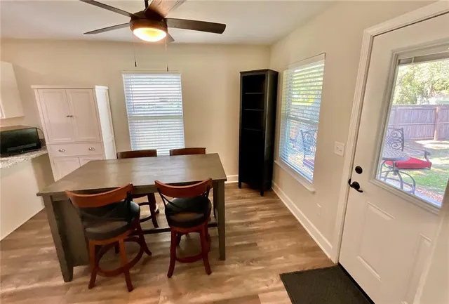 a bedroom with a bed couch and dresser