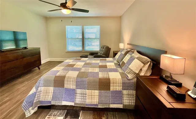 a white toilet sitting next to a shower