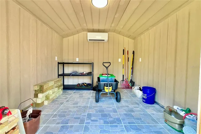 a view of a house with backyard porch and sitting area