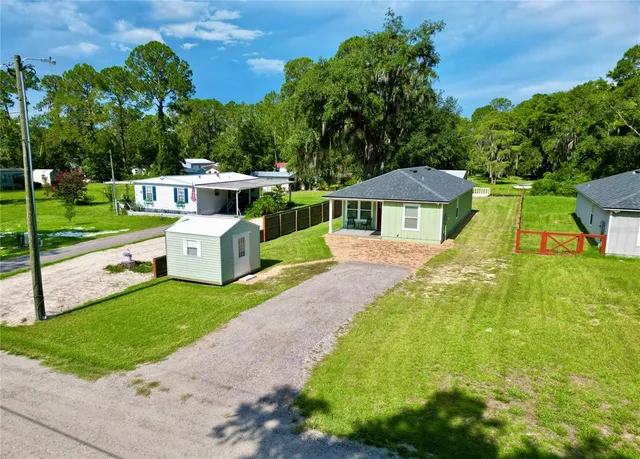 a balcony view with a large tree