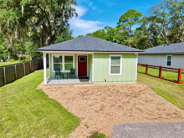 a view of balcony with wooden floor and fence