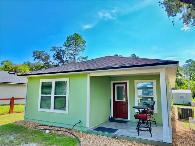 a view of a park with large trees