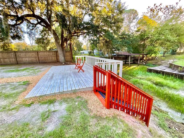 an aerial view of residential houses with outdoor space and street view