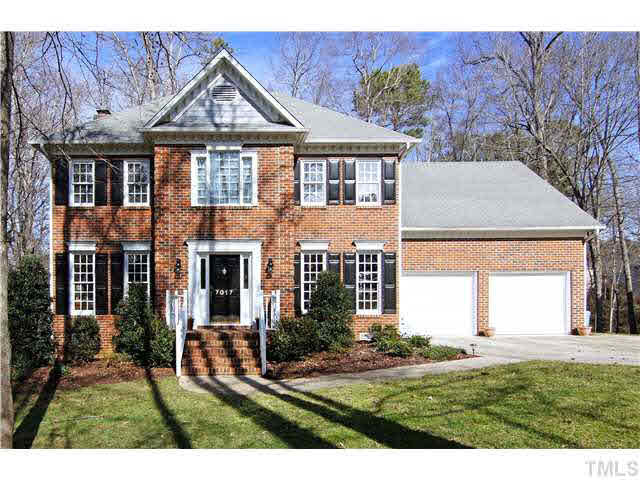 7017 Spring Ridge Road Cary, NC 27518 - Photo 1 of 25 Stately brick-front with mature landscaping in the conveniently located Wynston Ridge. Exterior Front