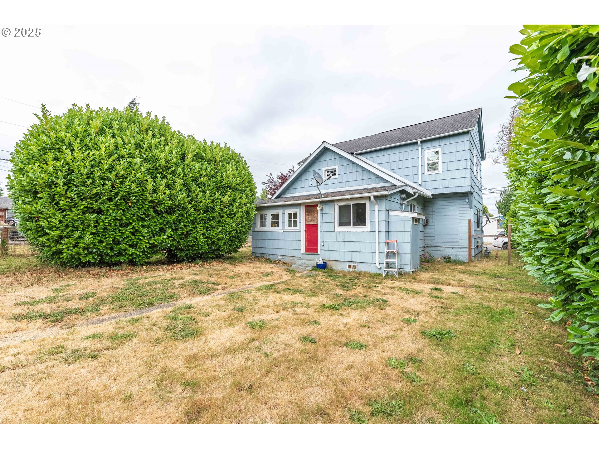 3236 Sheridan Avenue North Bend, OR 97459 - Photo 18 of 20 a view of a house with a yard and garage