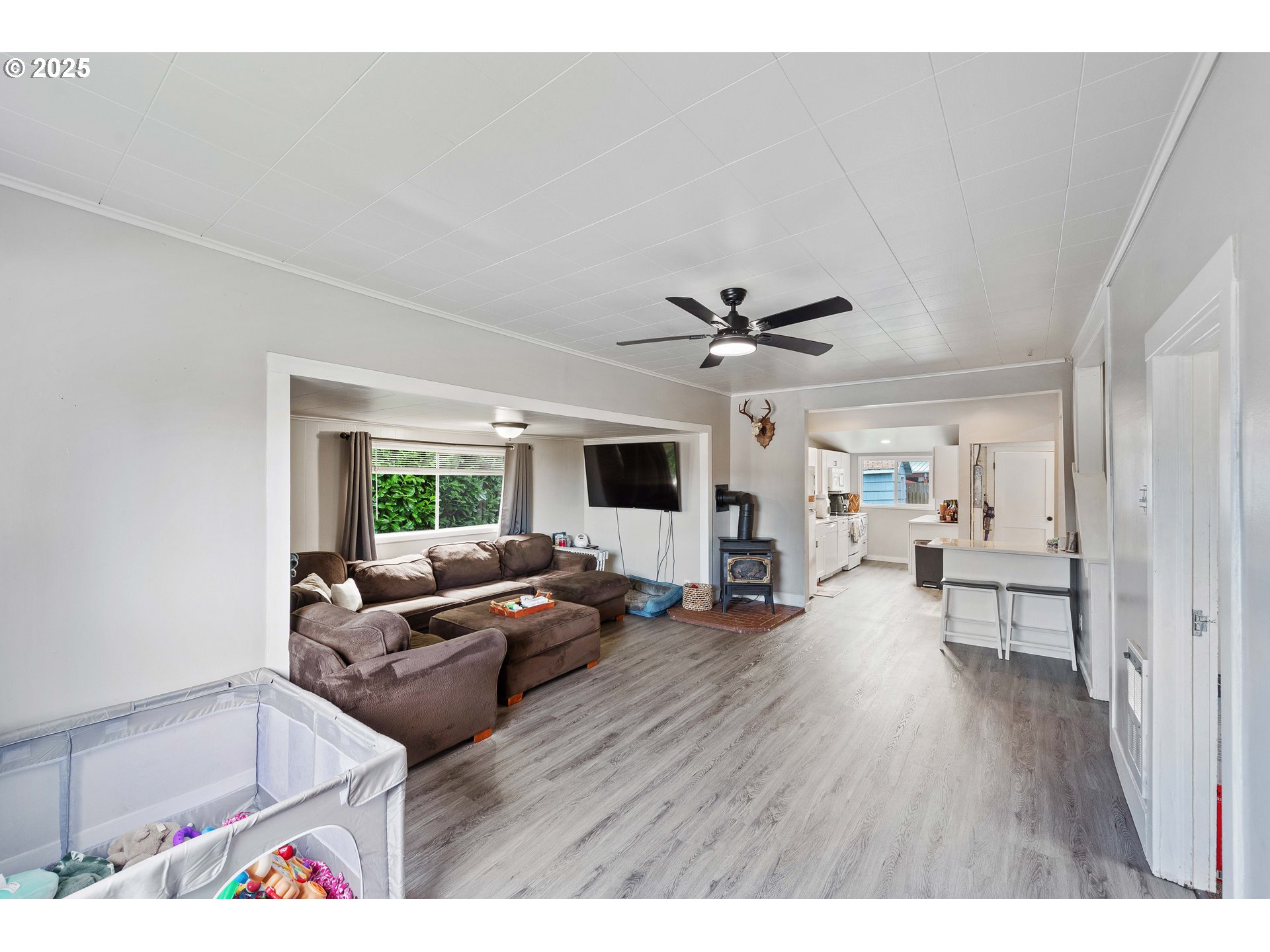 3236 Sheridan Avenue North Bend, OR 97459 - Photo 2 of 20 a living room with furniture and a wooden floor