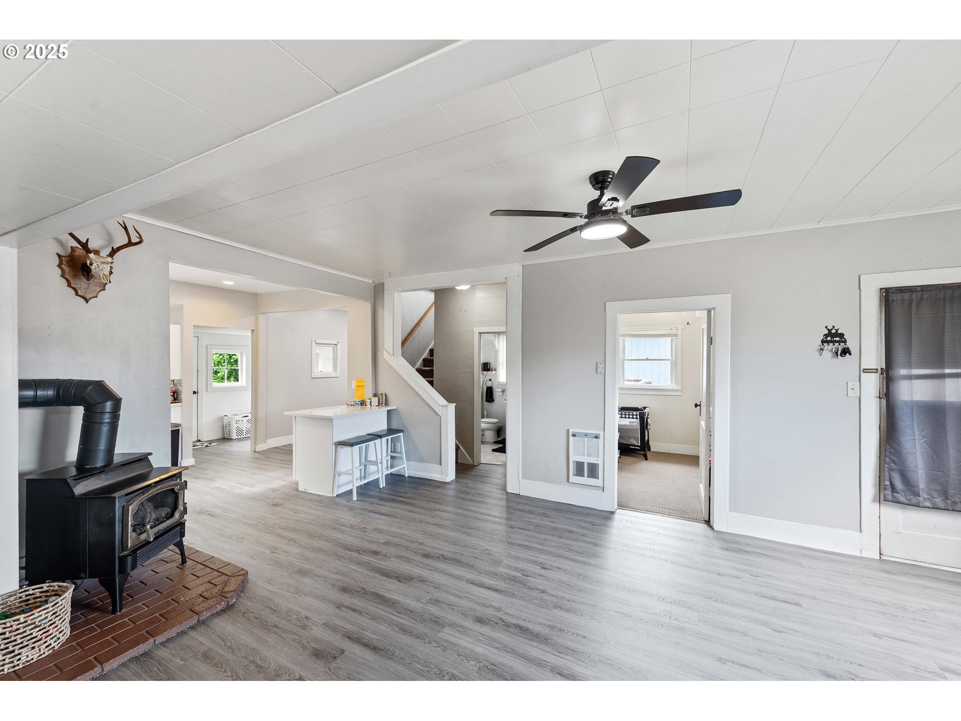 3236 Sheridan Avenue North Bend, OR 97459 - Photo 4 of 20 a living room with couches and a view of kitchen