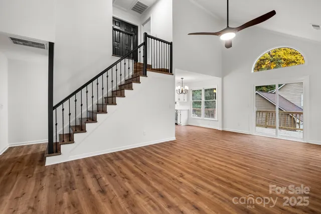a view of an entryway with wooden floor