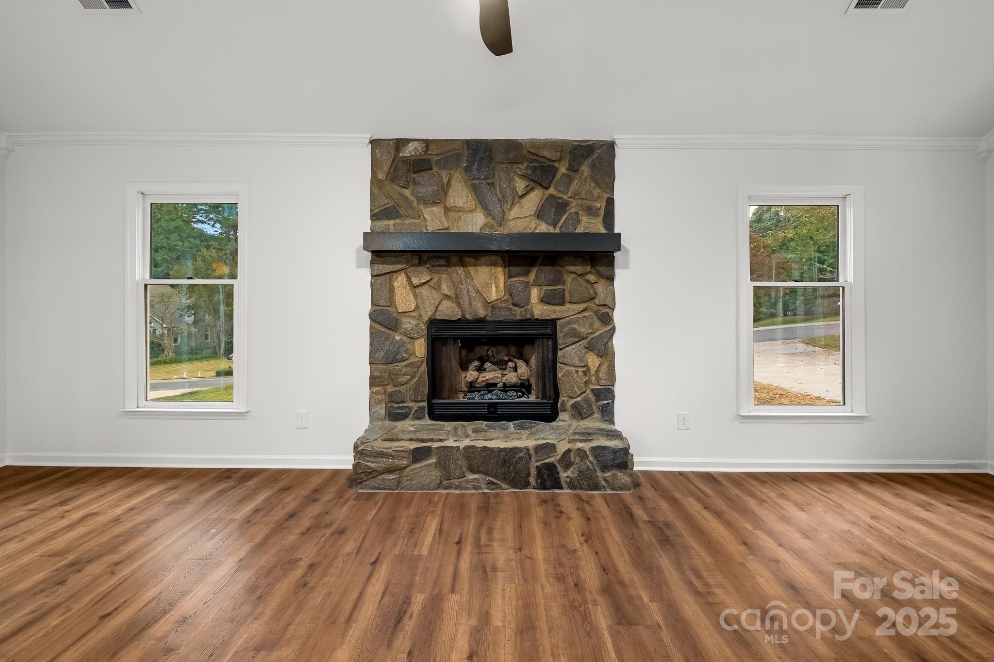 101 Banks Ridge Road Fort Mill, SC 29715 - Photo 11 of 34 an empty room with windows and fireplace