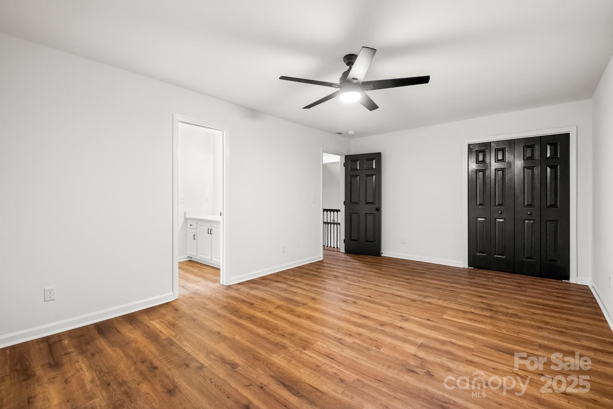 101 Banks Ridge Road Fort Mill, SC 29715 - Photo 2 of 34 a view of empty room with wooden floor and ceiling fan