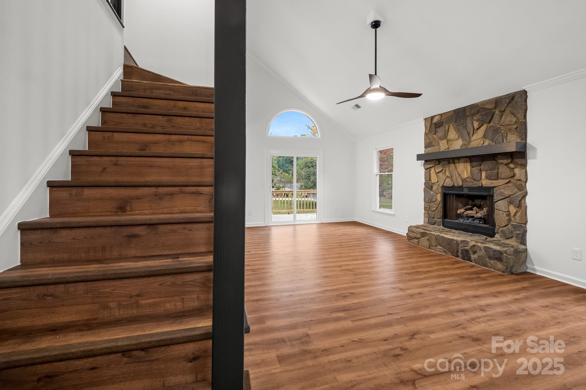 101 Banks Ridge Road Fort Mill, SC 29715 - Photo 9 of 34 a view of an empty room with wooden floor fireplace and a window
