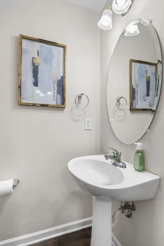 a bathroom with a sink mirror and vanity