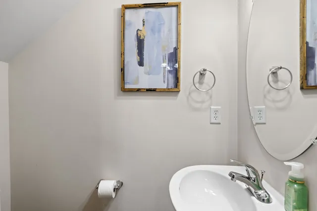 a bathroom with a sink and mirror