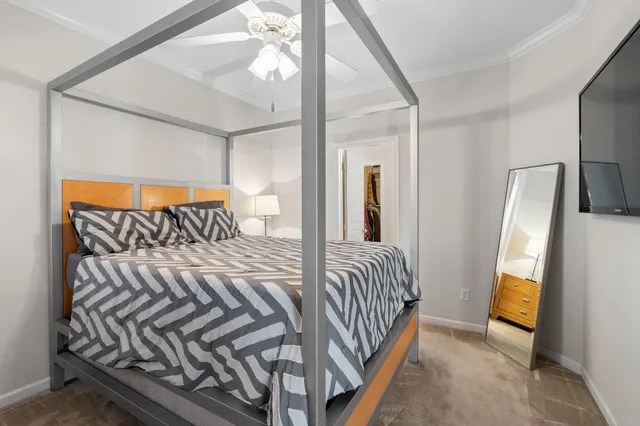 a bedroom with a bed and a mirror