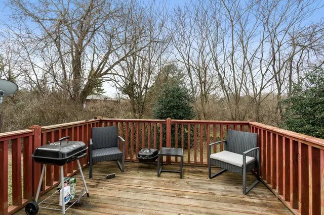 a view of balcony with furniture and trees
