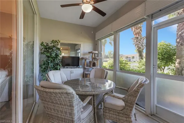 a kitchen with granite countertop a refrigerator and a stove top oven