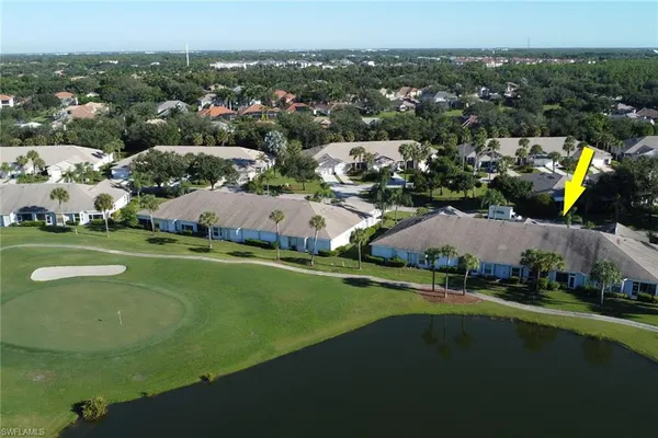 an aerial view of a house with swimming pool outdoor seating and yard