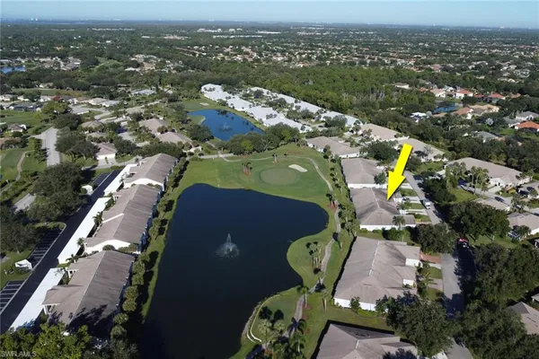 an aerial view of a house with a swimming pool yard and outdoor seating