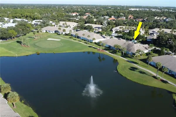 an aerial view of a house with a garden and swimming pool