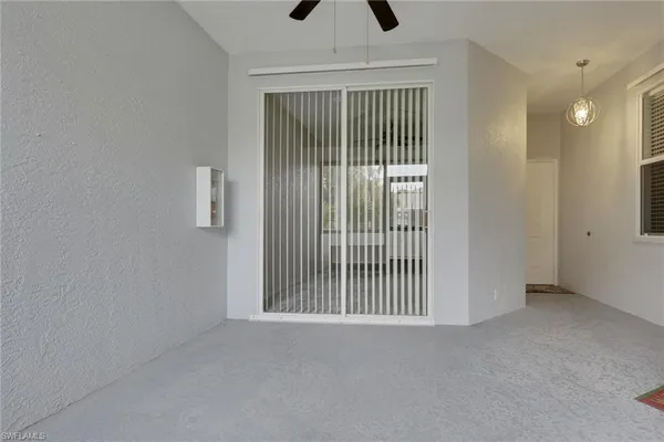 a view of empty room with floor to ceiling window