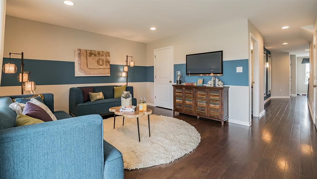 1403 Hights Farm Road South Raleigh, NC 27603 - Photo 6 of 25 a living room with furniture and a flat screen tv