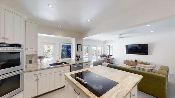a bathroom with a toilet a sink and shower