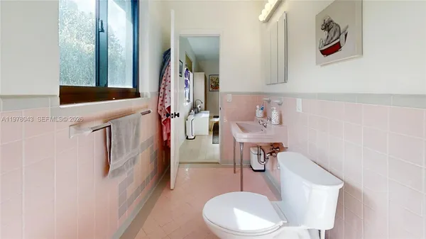 a bathroom with a shower and a toilet