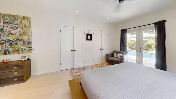 a living room with furniture window and wooden floor