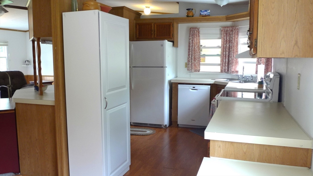 41 Pipers Way Carver, MA 02330 - Photo 13 of 36 a kitchen with stainless steel appliances granite countertop a refrigerator and a stove
