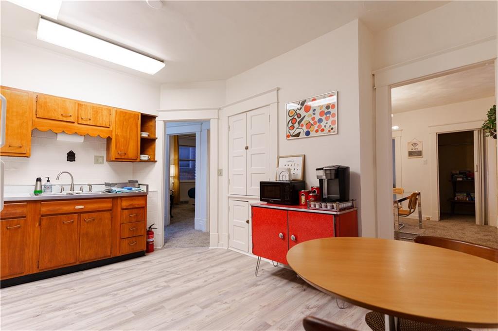 17 Bailey Avenue Pittsburgh, PA 15211 - Photo 12 of 22 a large kitchen with stainless steel appliances a stove a sink dishwasher and a refrigerator