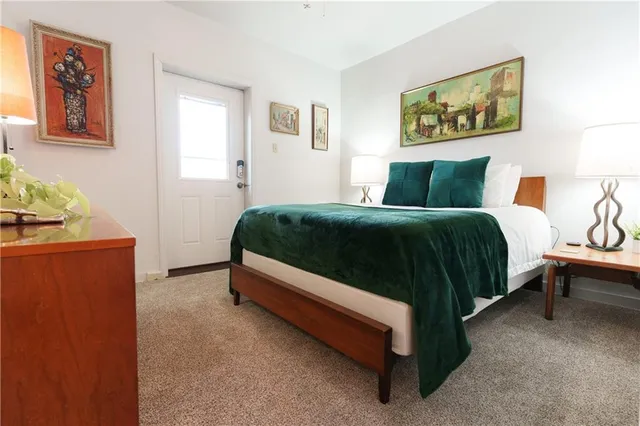 a bed room with a bed and a window