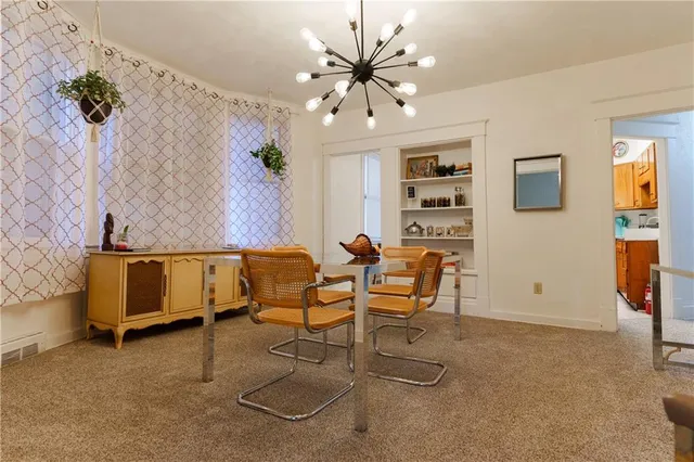 a view of a livingroom with furniture and a flat screen tv