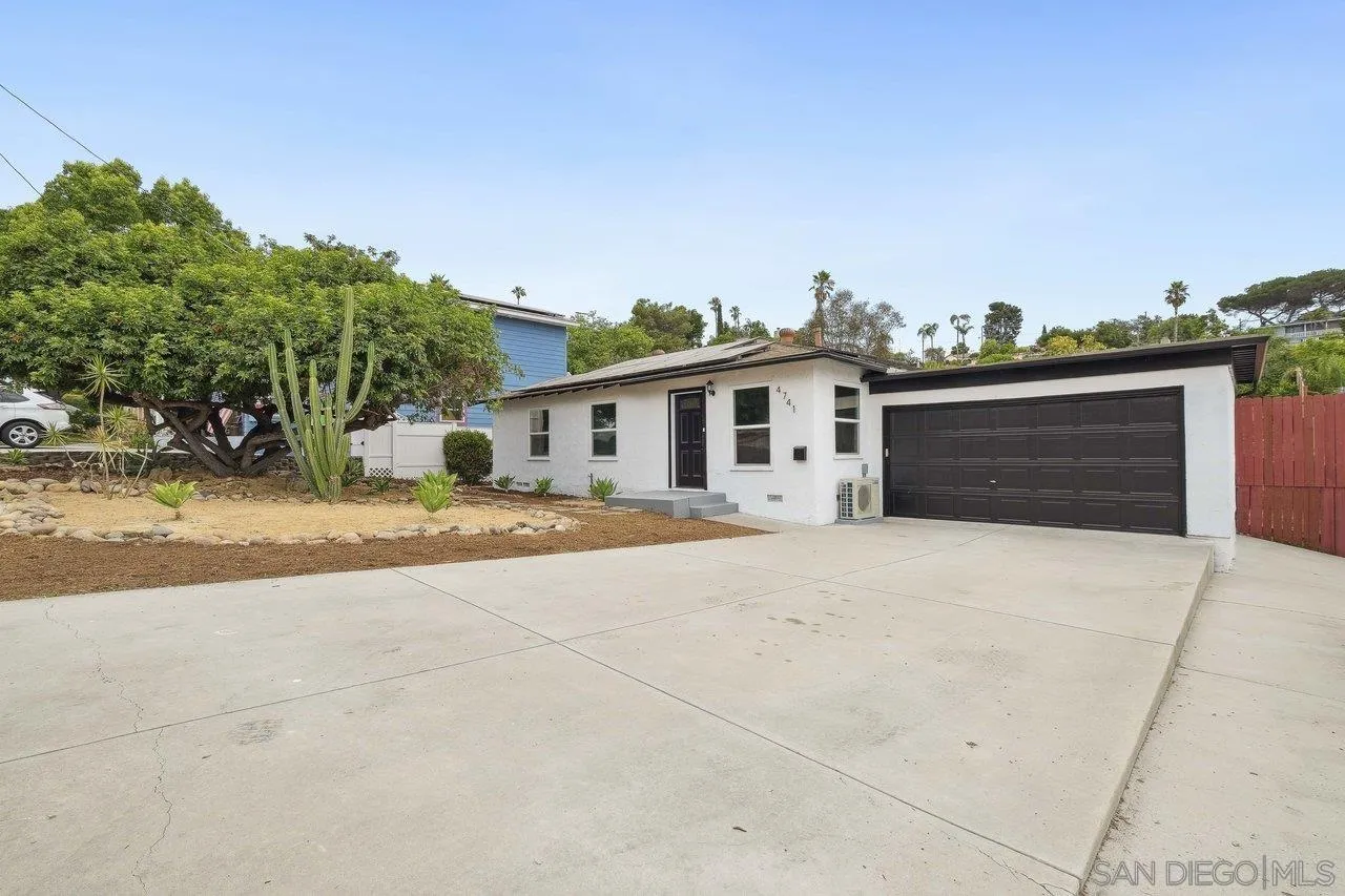 4741 Maple Avenue La Mesa, CA 91942 - Photo 2 of 34 a front view of a house with a yard and garage