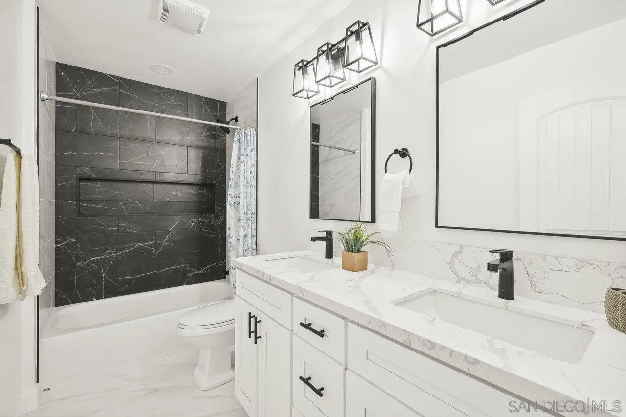 4741 Maple Avenue La Mesa, CA 91942 - Photo 22 of 34 a bathroom with a sink and a mirror