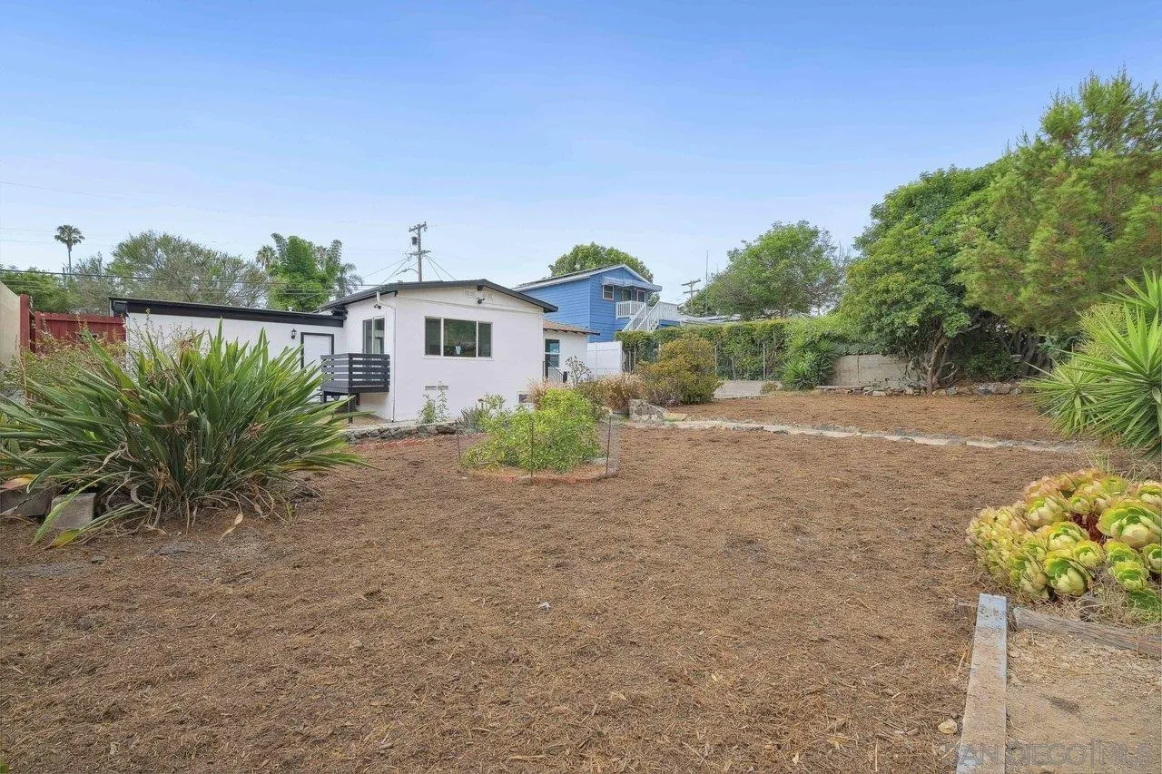 4741 Maple Avenue La Mesa, CA 91942 - Photo 29 of 34 a front view of a house with a garden