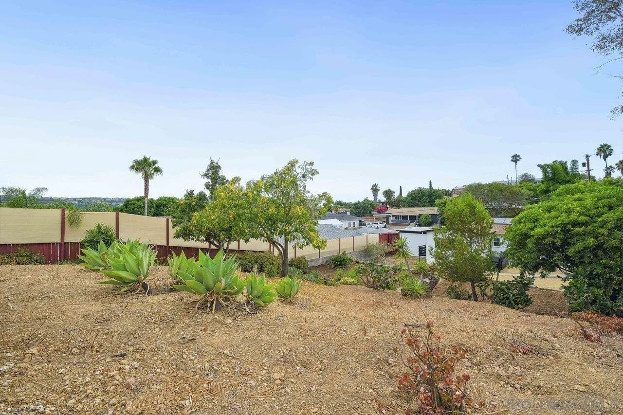 4741 Maple Avenue La Mesa, CA 91942 - Photo 31 of 34 a view of a garden with a building in the background