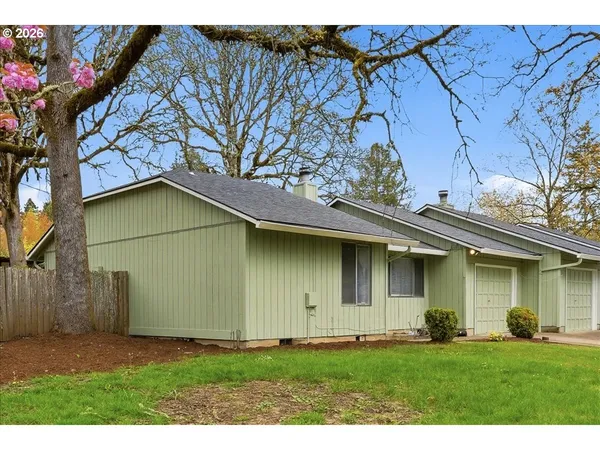 a view of front of house with a yard