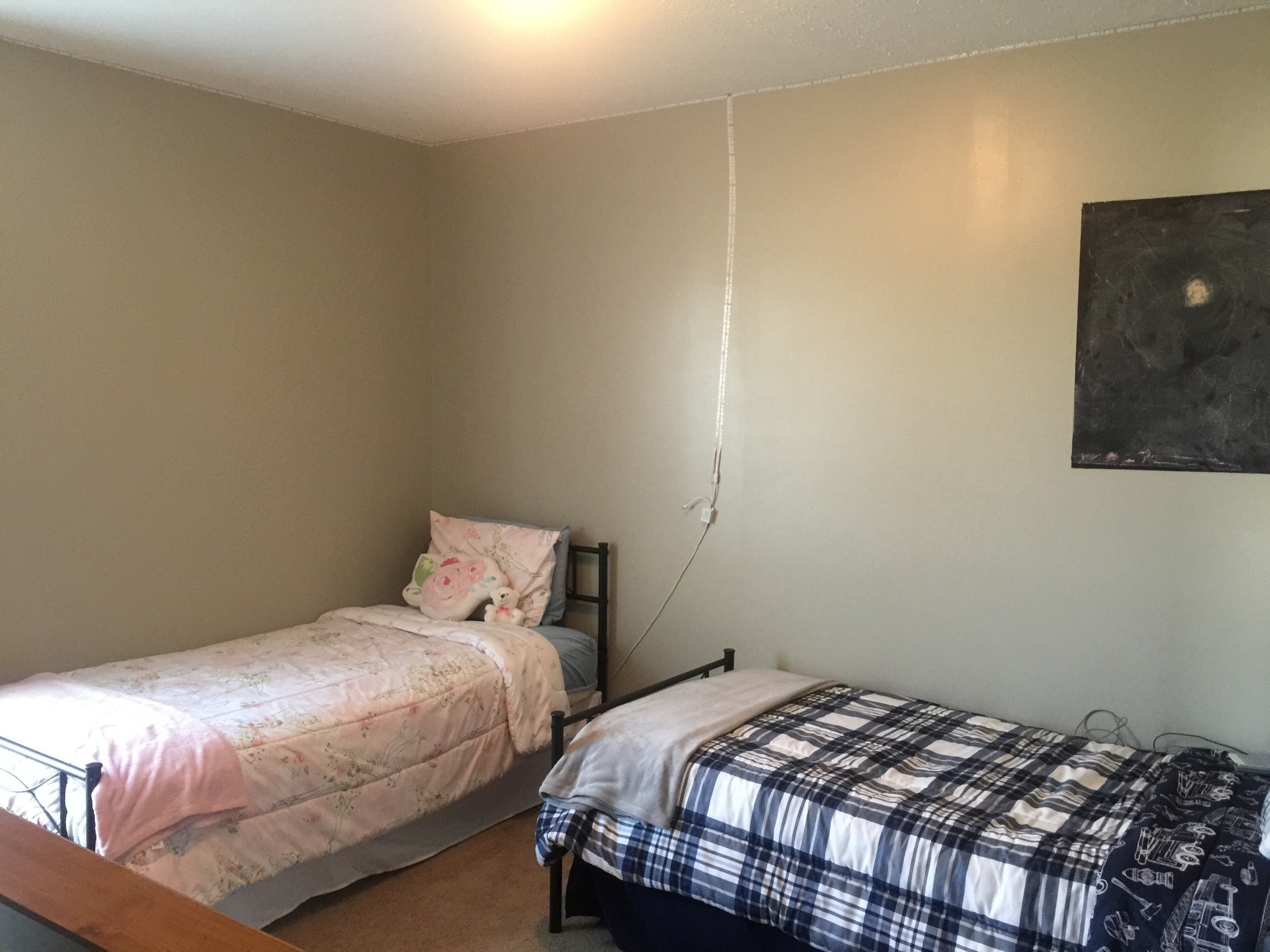 63 Robertson Hollow Road Taft, TN 38488 - Photo 14 of 16 a bedroom with a bed and painting on the wall
