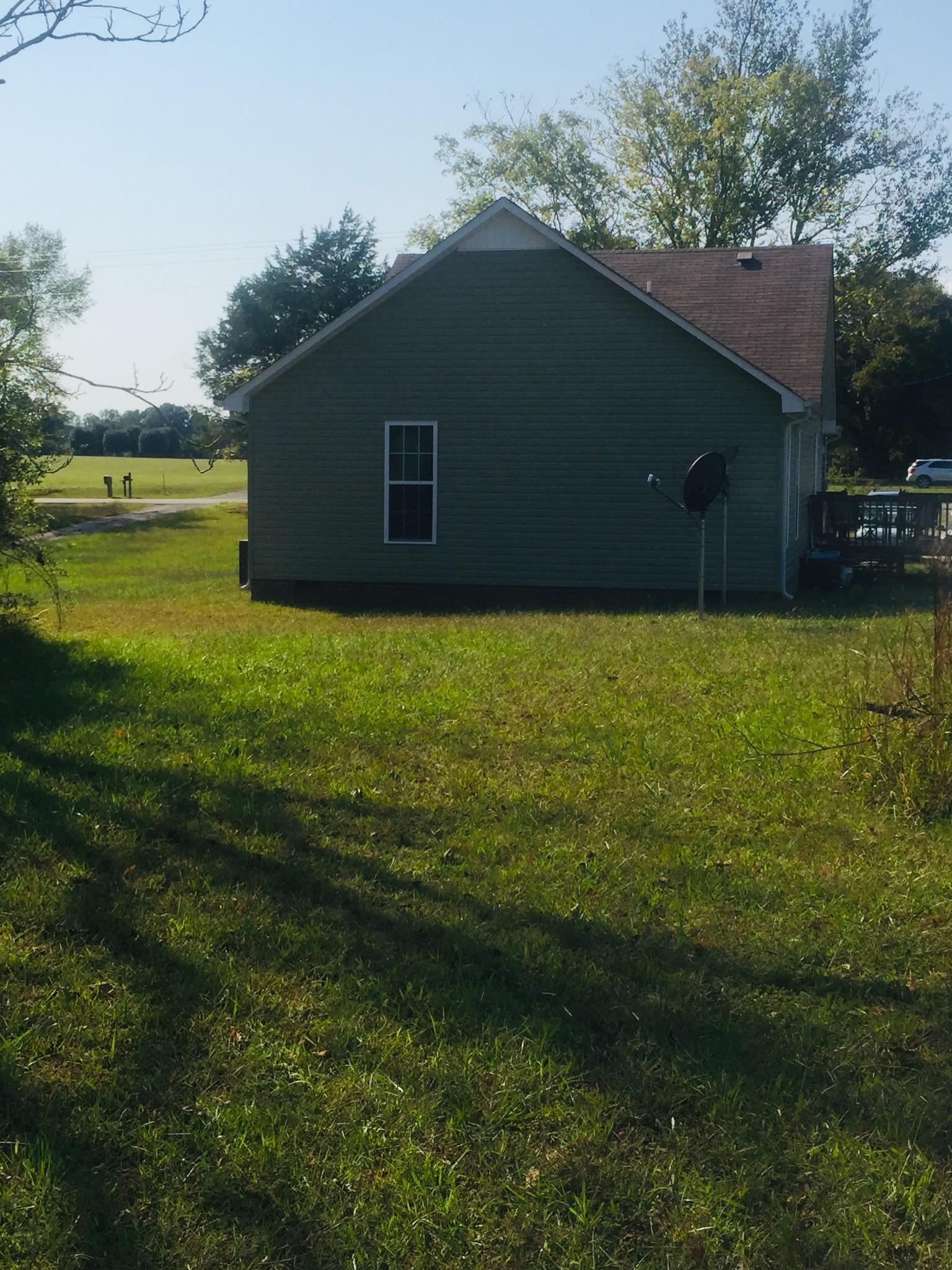63 Robertson Hollow Road Taft, TN 38488 - Photo 15 of 16 a backyard of a house with lots of green space and lake view