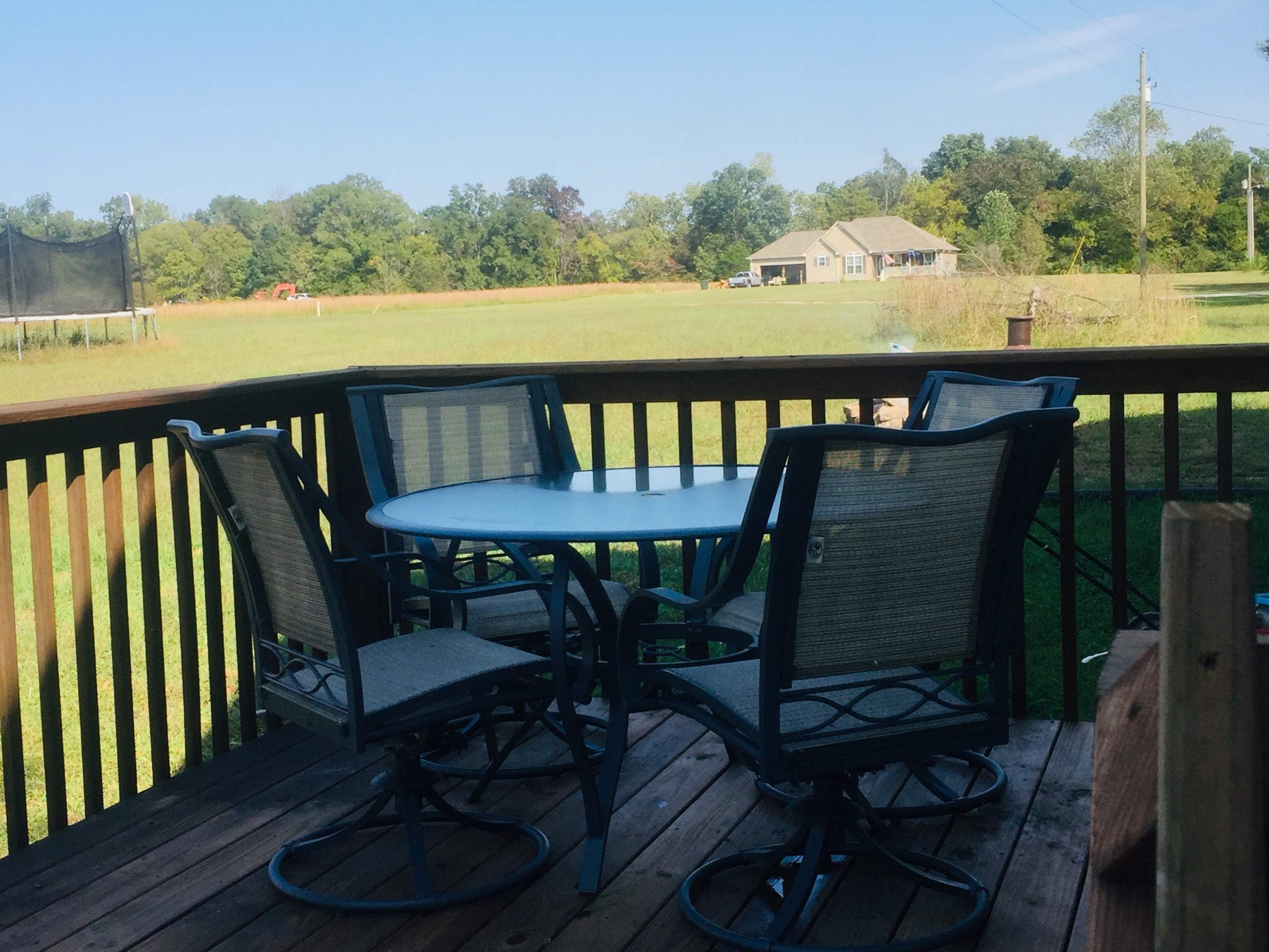 63 Robertson Hollow Road Taft, TN 38488 - Photo 16 of 16 a view of a balcony with chairs and wooden floor