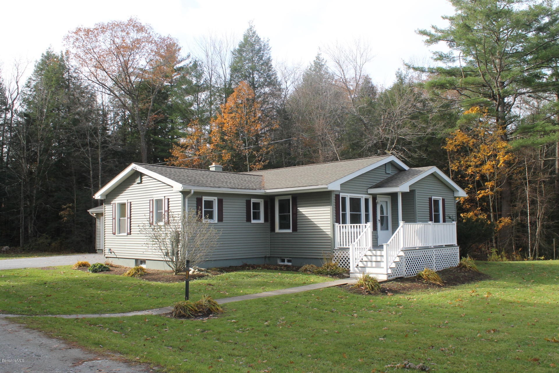 986 Middle Road Clarksburg, MA 01247 - Photo 1 of 20 a front view of a house with a yard and trees