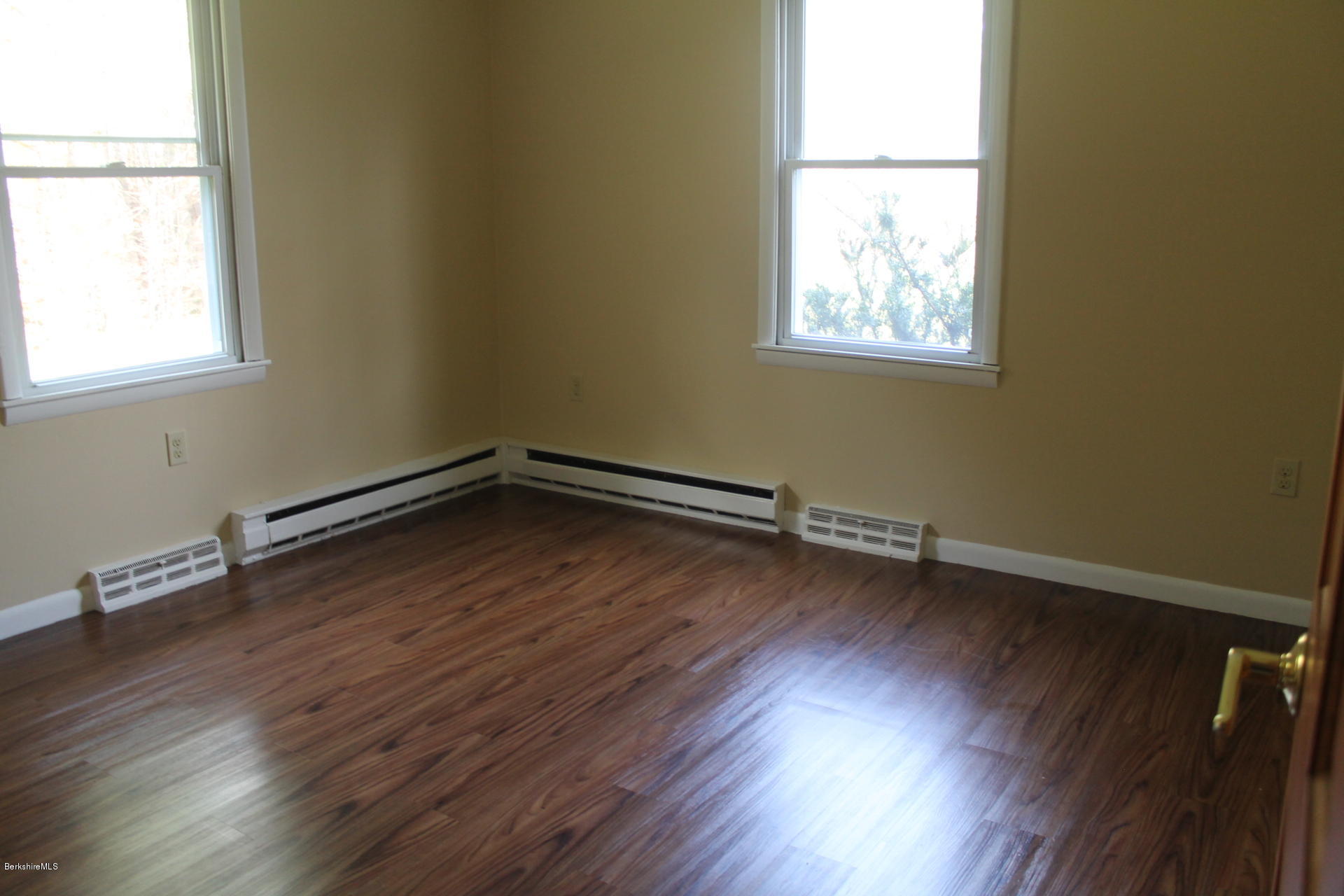 986 Middle Road Clarksburg, MA 01247 - Photo 12 of 20 an empty room with wooden floor and windows