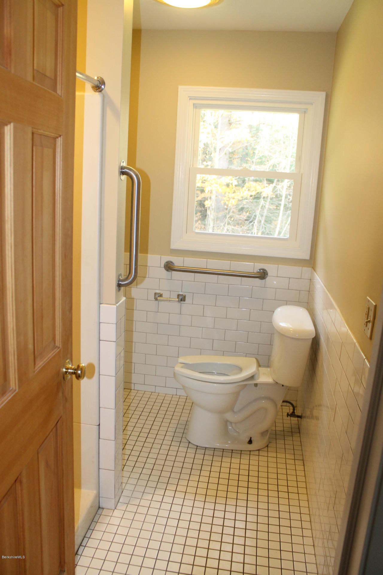 986 Middle Road Clarksburg, MA 01247 - Photo 13 of 20 a bathroom with a toilet a window and shower