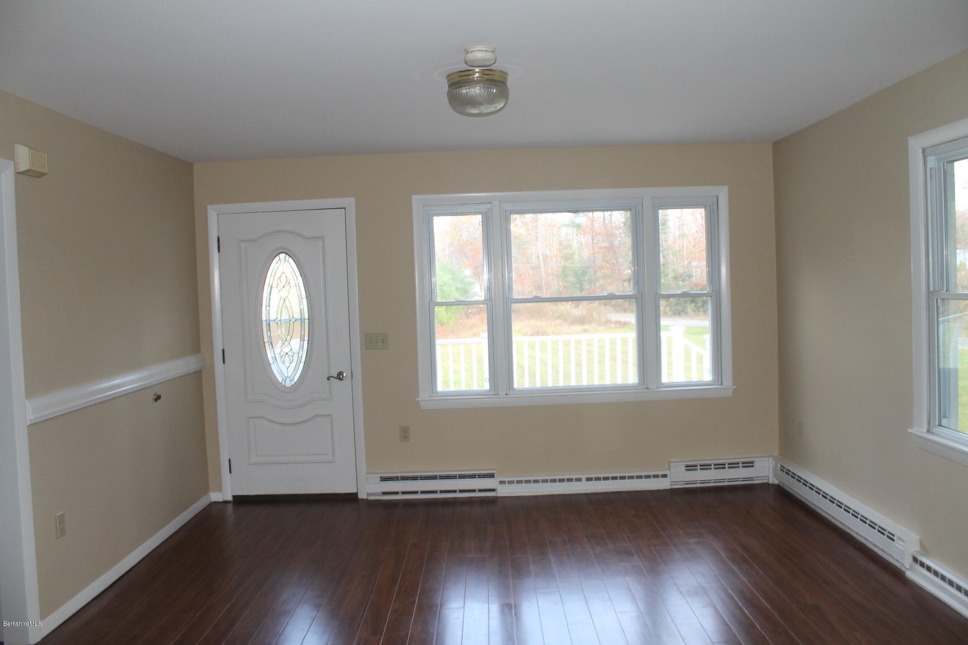 986 Middle Road Clarksburg, MA 01247 - Photo 9 of 20 an empty room with wooden floor and windows
